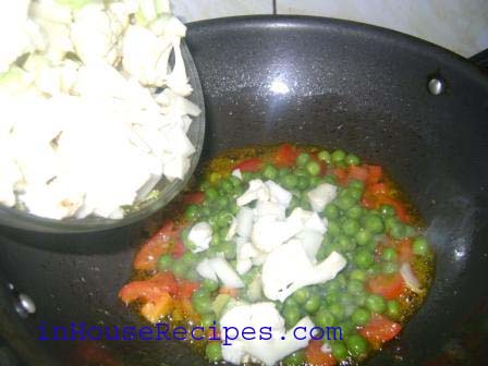 Now add chopped Cauliflower and Peas.